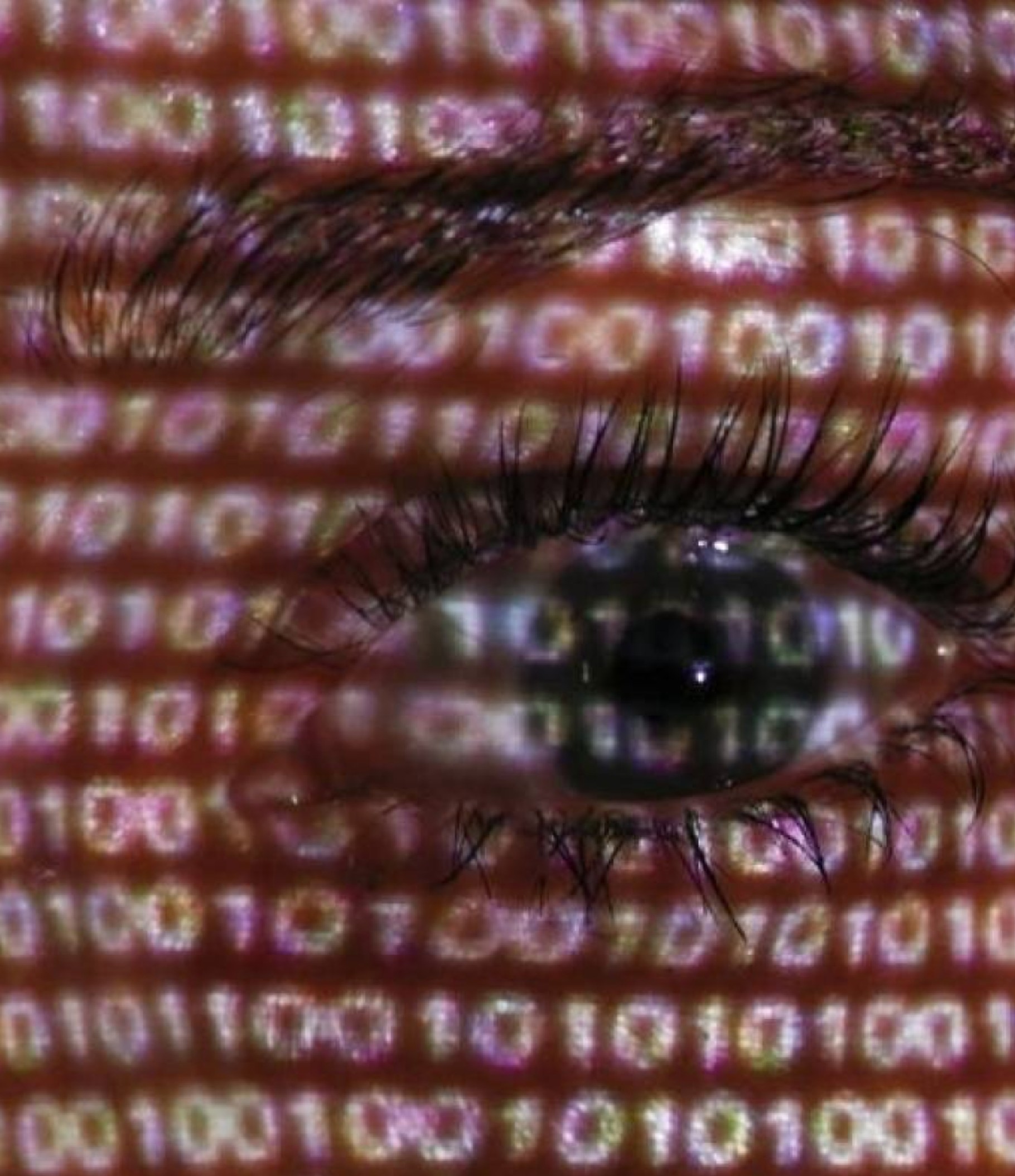 Closeup on a human eye overlayed with a binary code